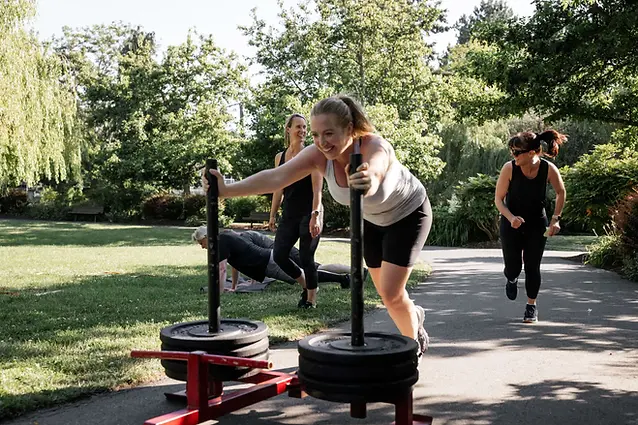 Women running outdoors during a full-body strength and conditioning session at VBC Fitness