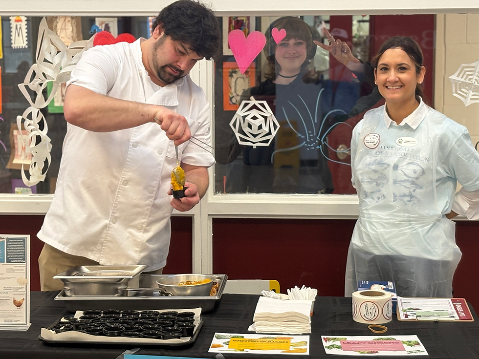 Chef Joe Robbins serves up pollock at Bangor High School
