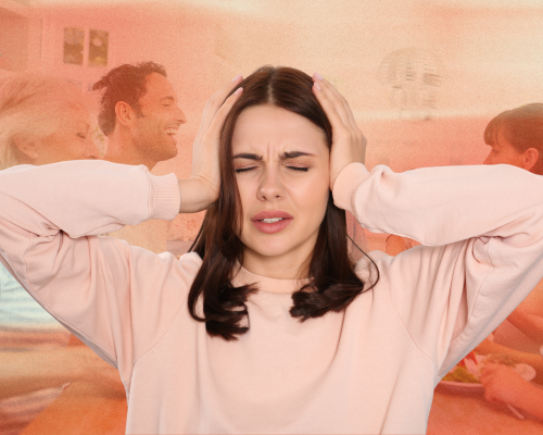 a woman plugging her ears