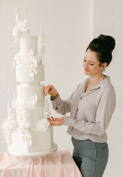 Holly Miller: Award-Winning Luxury Wedding Cake Designer in Somerset Experience the exquisite artistry of Holly Miller's bespoke wedding cakes. Based in Somerset, this award-winning designer creates stunning, personalized masterpieces for discerning couples. From elegant classic designs to avant-garde creations, Holly Miller's luxury wedding cakes are tailored to your unique style. Serving Devon, Cotswolds, London, Dorset, and surrounding areas, Holly Miller ensures your dream wedding cake becomes a reality.