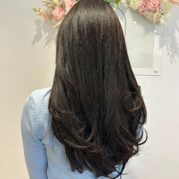 flicky blow on long dark brown hair 
