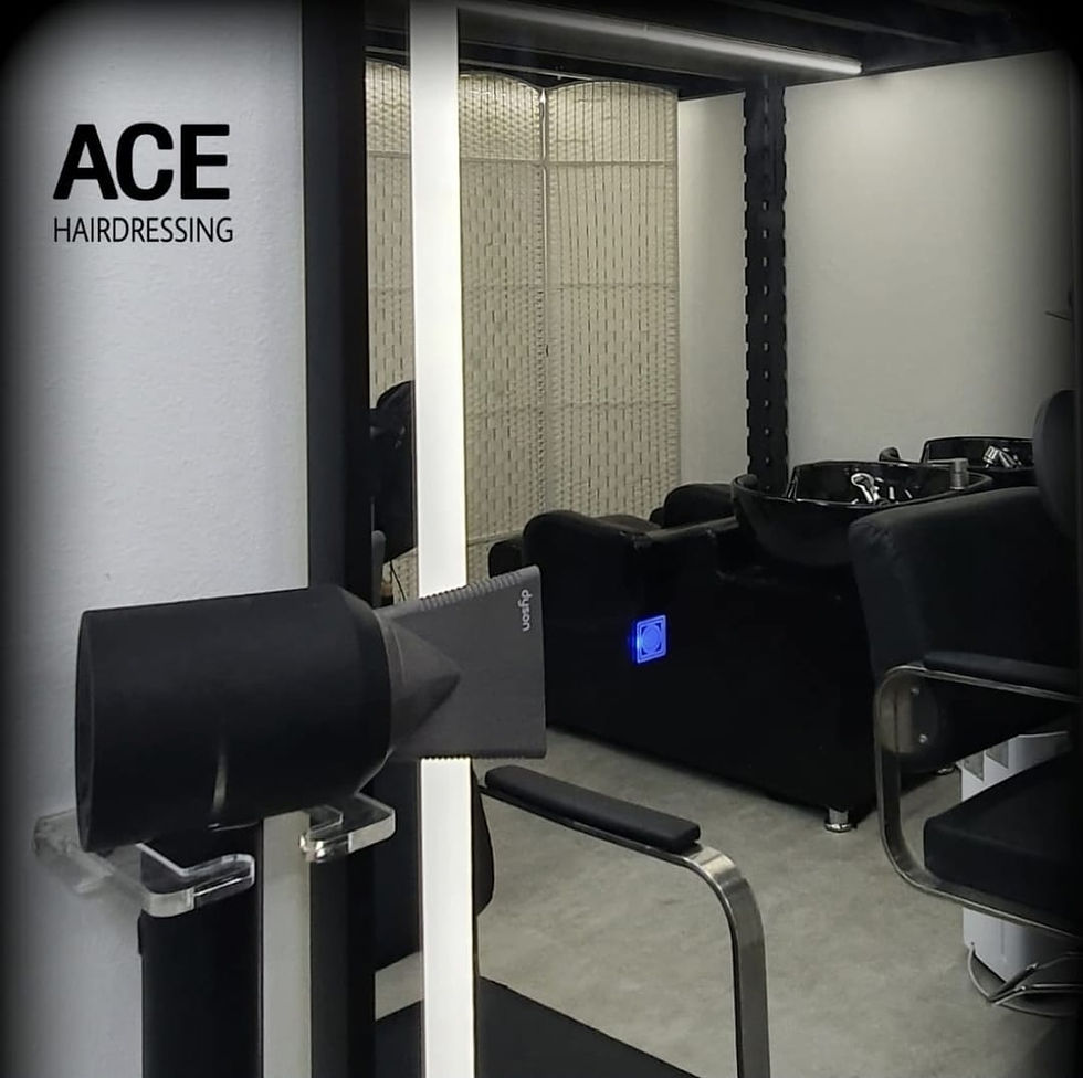 Wide-angle view of a calm neighbourhood hair salon interior with styling chairs and warm lighting