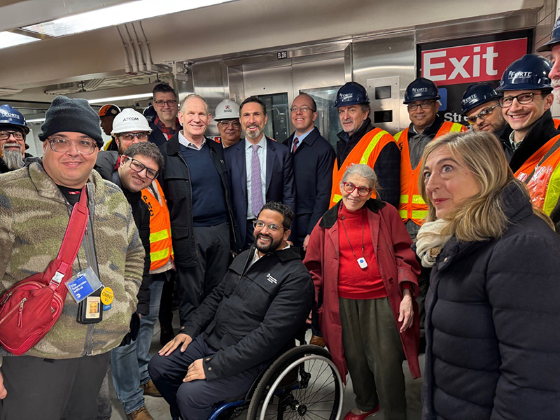 MTA CEO Janno Lieber, President of MTA Construction and Development Jamie Torres-Springer, FTA Regional Administrator Michael Culotta and MTA Chief Accessibility Office Quemuel Arroyo (center) celebrate with construction leaders and local disability adv