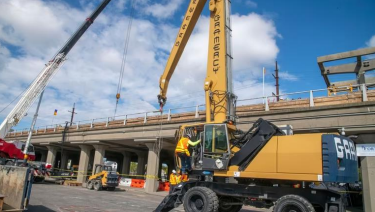 Work is underway to install two new elevators and update four escalators at the Babylon LIRR station, a major accessibility upgrade. Credit: Rick Kopstein