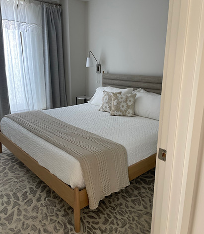 King bed made with fresh linens during an Airbnb turnover by On the Flye in Belfast, Maine