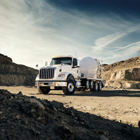 International HX-Series concrete mixer truck, whose drum rotation speed shifts between mixing, agitating, and discharge stages on every load