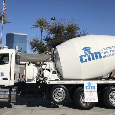 Kenworth T880S chassis fitted with a Con-Tech BridgeKing mixer body, cross-shopped by fleets against a comparable McNeilus Bridgemaster build