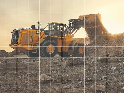 A John Deere wheel loader handling material