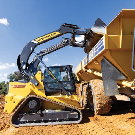A modern New Holland compact track loader, a descendant of a company that began as a blacksmith shop in 1895, official New Holland product photo