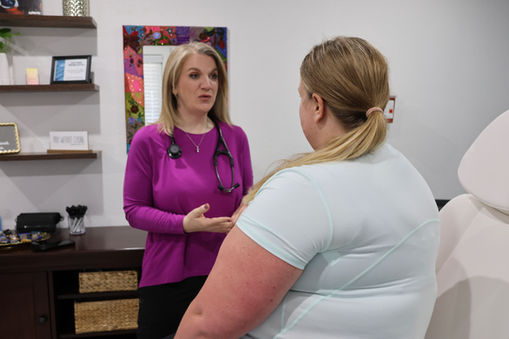 Family Nurse Practitioner consulting patient, weight loss