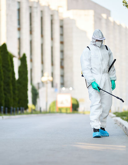 man-protective-suit-disinfecting-city-streets-coronavirus-pandemic.jpg