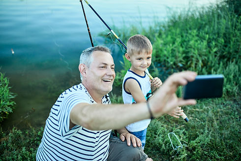 grandfather-and-grandson-taking-selfie-with-smartp-2024-09-18-20-57-23-utc.jpg