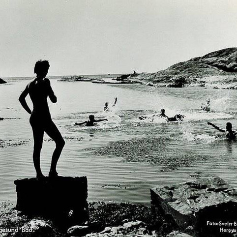 person viewing the ocean in a historic bathing picture
