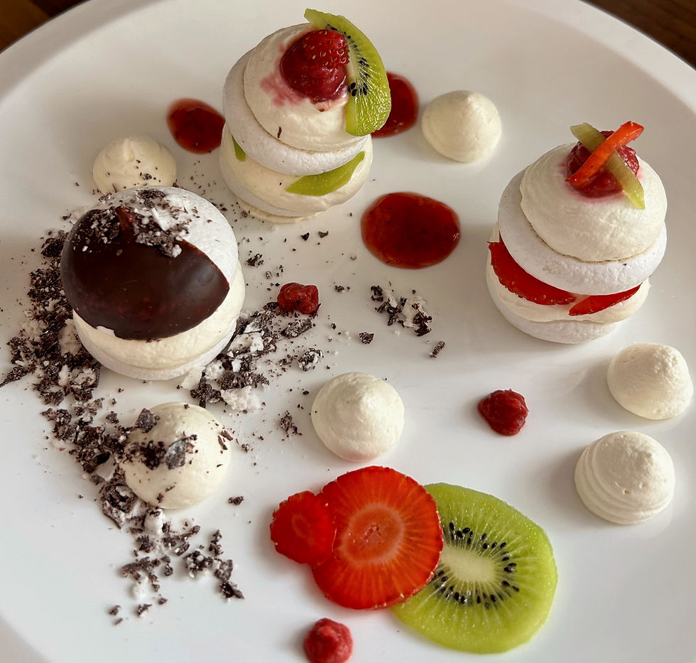 Thumbnail: Three layered mini Veringue® vegan meringue desserts with whipped cream, strawberries, and kiwi