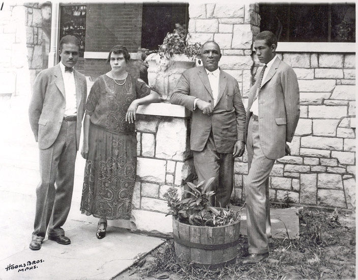 From left to right: Thomas Hayes, Jr., Florence Hayes, Thomas Hayes, Sr., and Taylor Hayes pose in front of their funeral home.