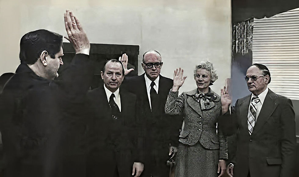 Alabama Supreme Court Chief Justice Howell Heflin (far left) swears-in Alabama State Board of Education members Charles Carmichael (Tuscumbia), Harold Martin (Birmingham), Isabell Thomason (Montgomery), and Ralph Higginbotham (Anniston), in January 1975. The entire Board was all-white at that time.