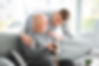 Male caregiver with senior man in nursin