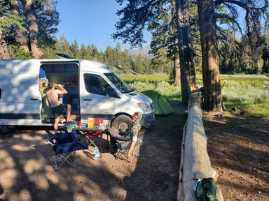 Setting up our table and chairs for dinner at camp. 