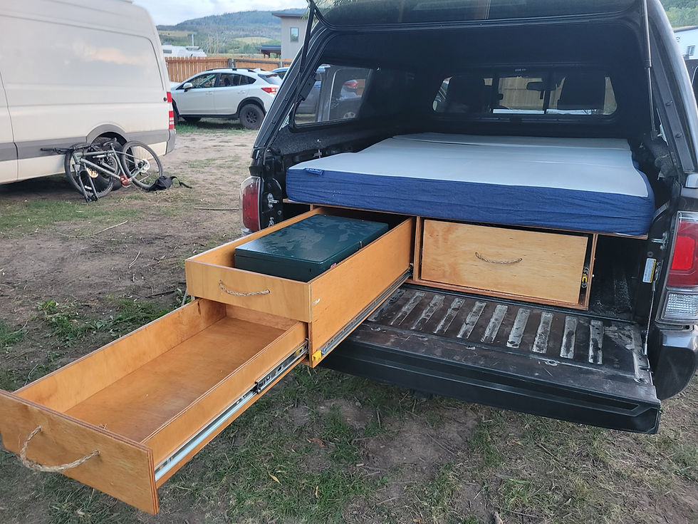 Toyota Tacoma truck build out with a memory foam mattress for camping.