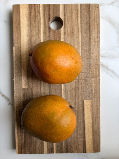 Two ripe mangoes with bright color and natural sweetness for mango lassi recipe