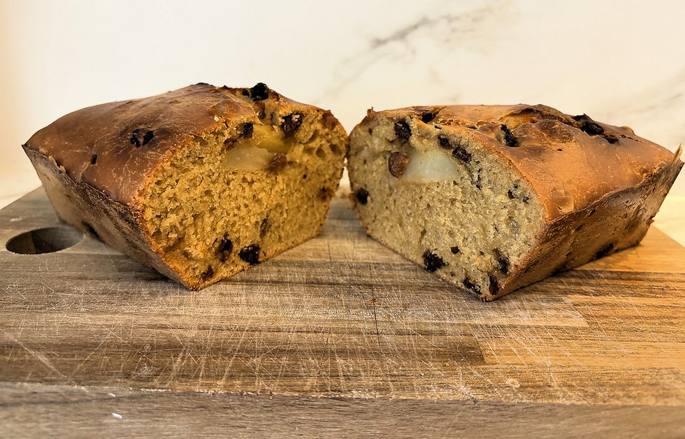 Baked sourdough apple raisin cake sliced in half