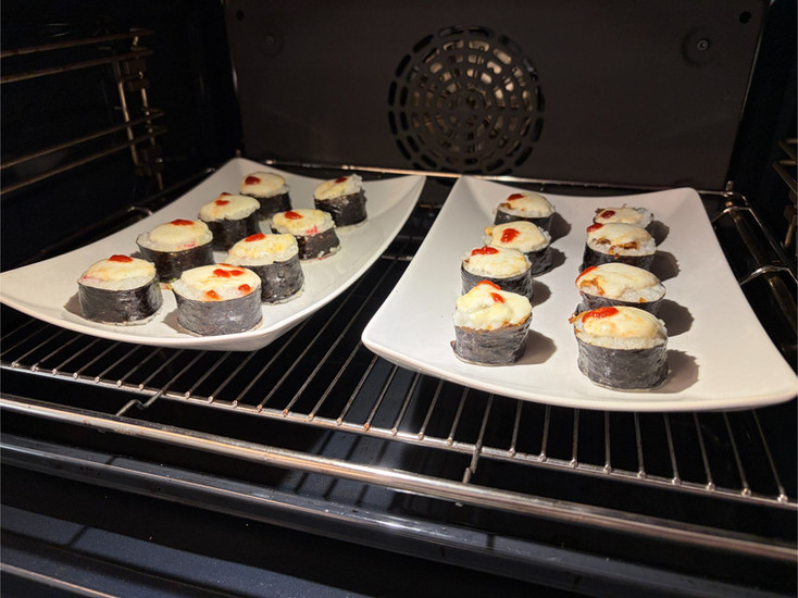 Oyster Mushroom Lava Roll Sushi under the grill as mozzarella melts into a creamy lava topping