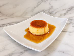 Extra creamy vanilla bean crème caramel ready to eat with rich homemade caramel sauce