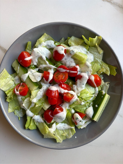 Adding tomatoes and yoghurt dressing to the low carb chicken salad