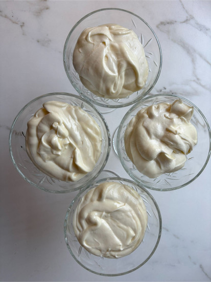 Final white chocolate mousse set and served in a glass