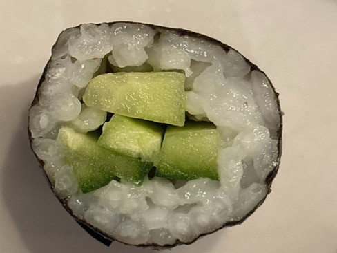 Kappa maki sushi roll filled with fresh cucumber and wrapped in nori with seasoned sushi rice