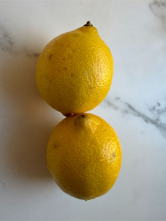 Fresh whole lemons for lemon muffin recipe ingredient base