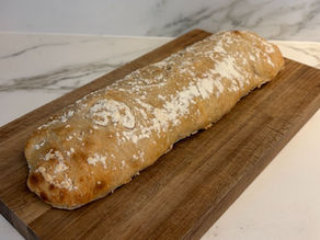 Freshly baked sourdough ciabatta straight from the oven with a golden crust and airy crumb