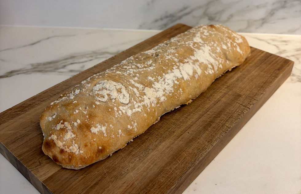 Freshly baked sourdough ciabatta straight from the oven with a golden crust and airy crumb