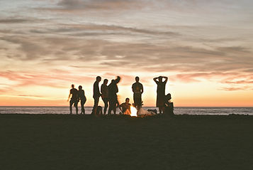 group of people setting up campfire_edit