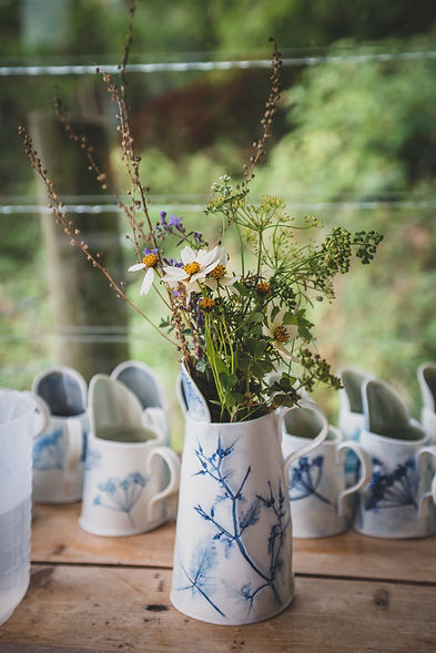 Tall handmade porcelain jug decorated with imprinted wild flower Herb Robert in Cobalt blue.