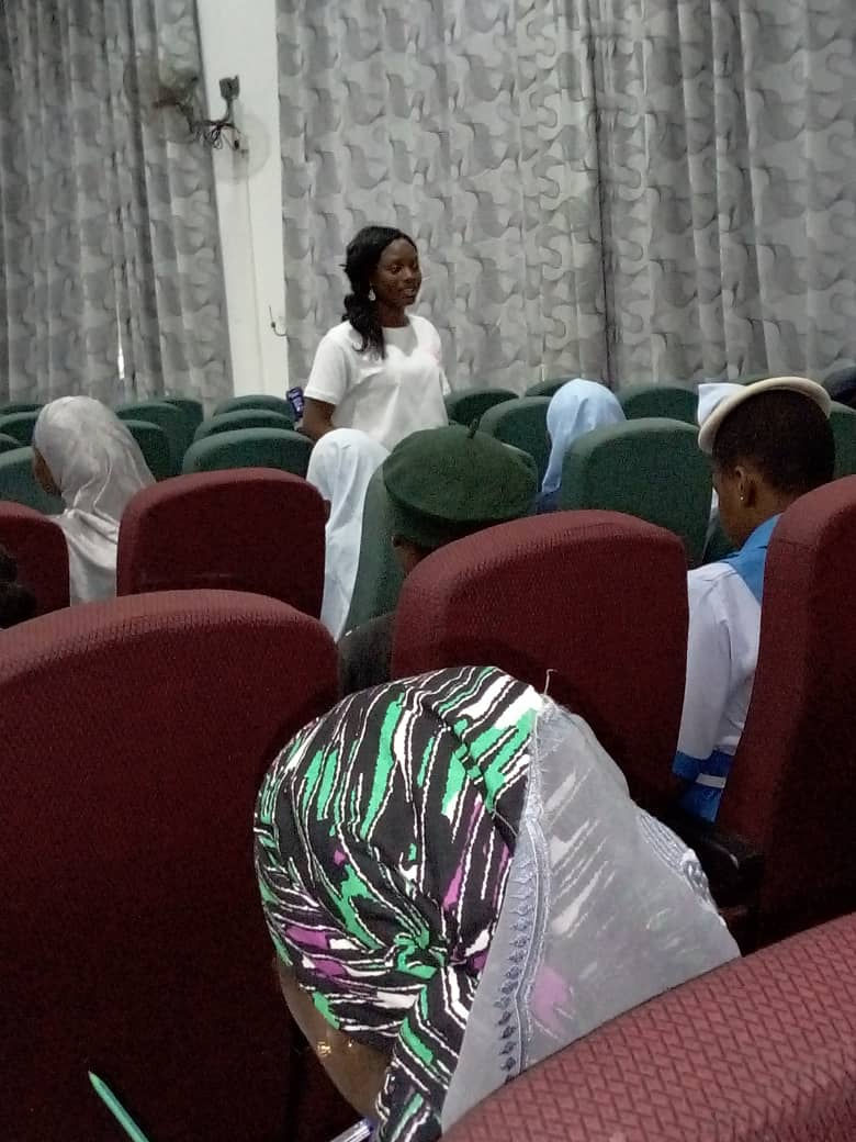 Mercy speaking to girls about pursuing their dreams.