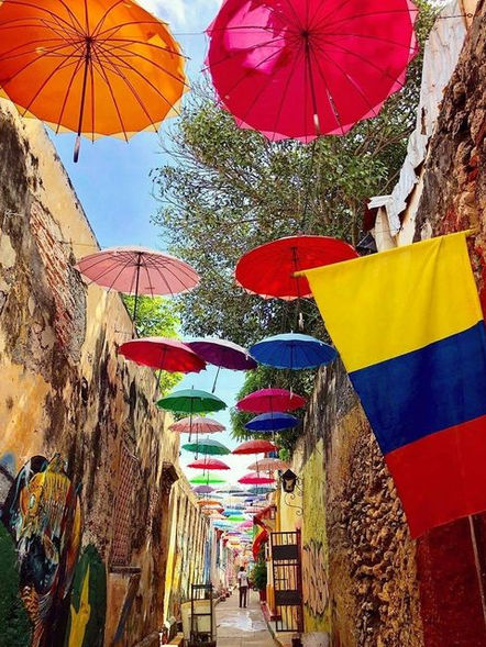 Callejon Ancho,  colorful umbrellas swaying above street in cultural  Getsemani Cartagena