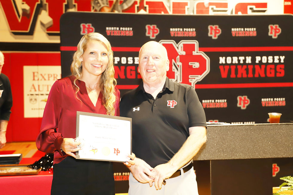 Emily Maier Stevens is inducted into the North Posey High School Athletic Hall of Fame on Saturday evening during the organization’s annual ceremony. Presenting the award is Tim Mauck. Photo by Dave Pearce