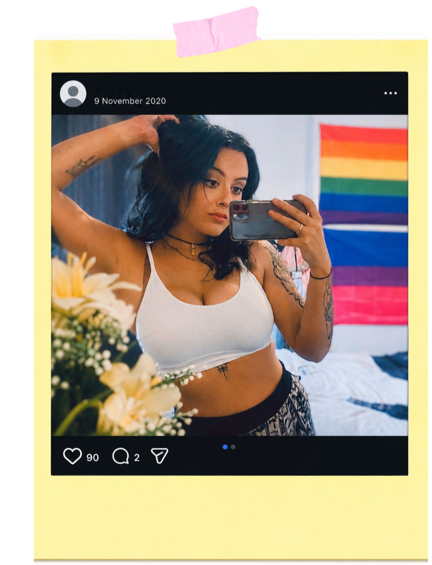 Woman taking a mirror selfie in a bedroom, with a rainbow pride and bisexual flag behind her and an Instagram-style post dated 9 November 2020.