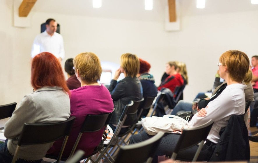 patients sitting in a chiropractic lecture class