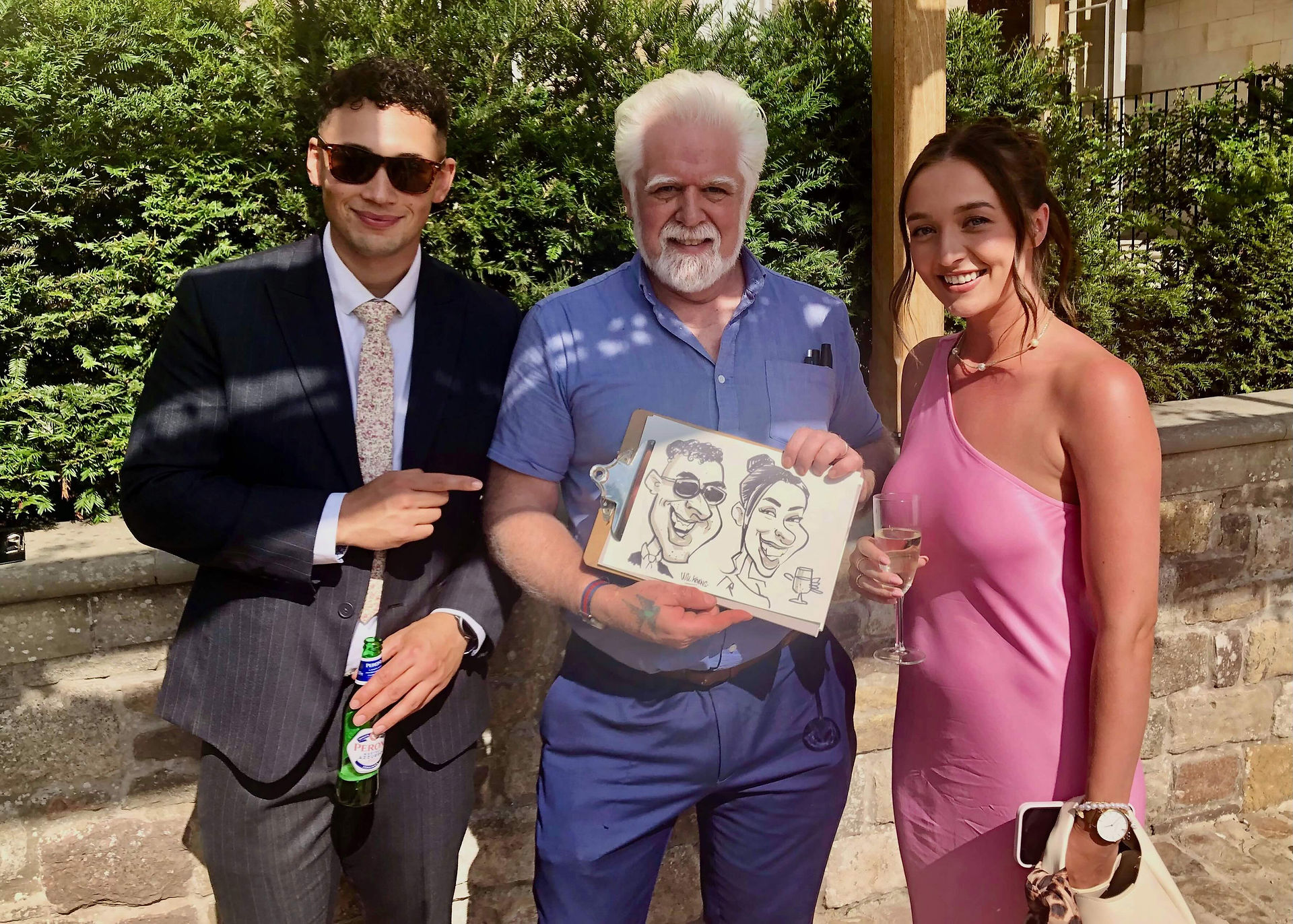 Caricaturist with wedding guests in Chepstow, Wales