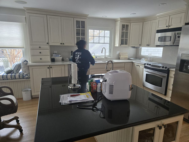 Cleaning professionals deep cleaning a luxury vacation home kitchen in Long Beach Island NJ.