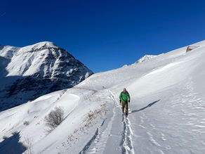 Ski touring uphill in the Vallée de la Maurienne, preparing for fresh first turns in the French Alps