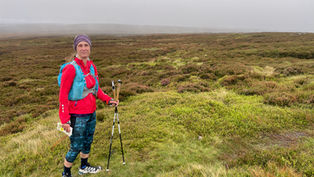 Sarah Gilbertson Nordic walking outdoors on a hill - real-world movement and professional experience