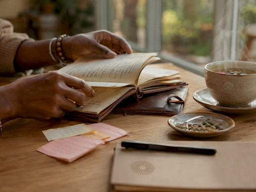 Hands organizing healthcare notes at home