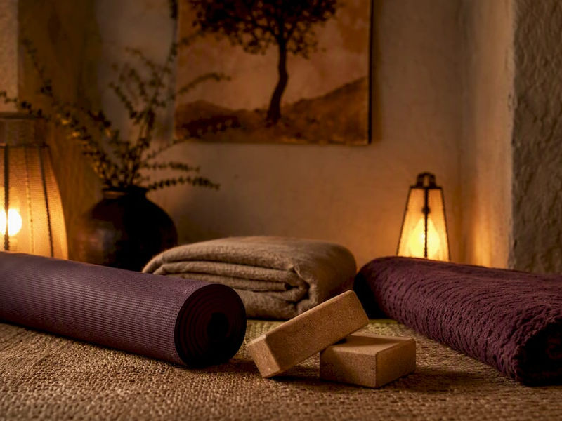 Yoga mat with blankets and blocks ready for practice