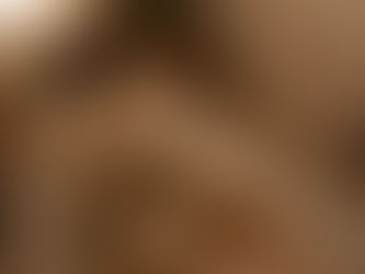 Person reflecting quietly in warm living room