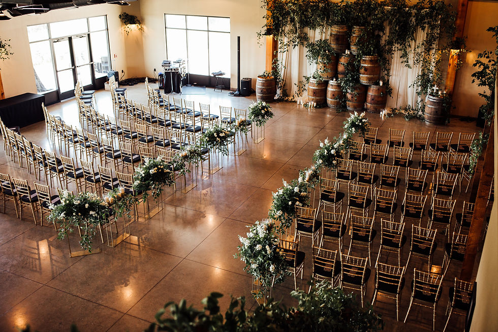A shot from above in the Event Center, with rows of chairs creating an aisle for a wedding ceremony.