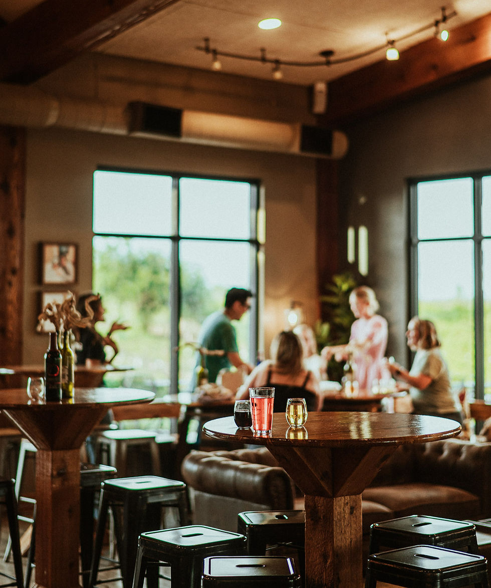 The interior of the Tasting Room, with a blurred group of people sitting at a table in the background.