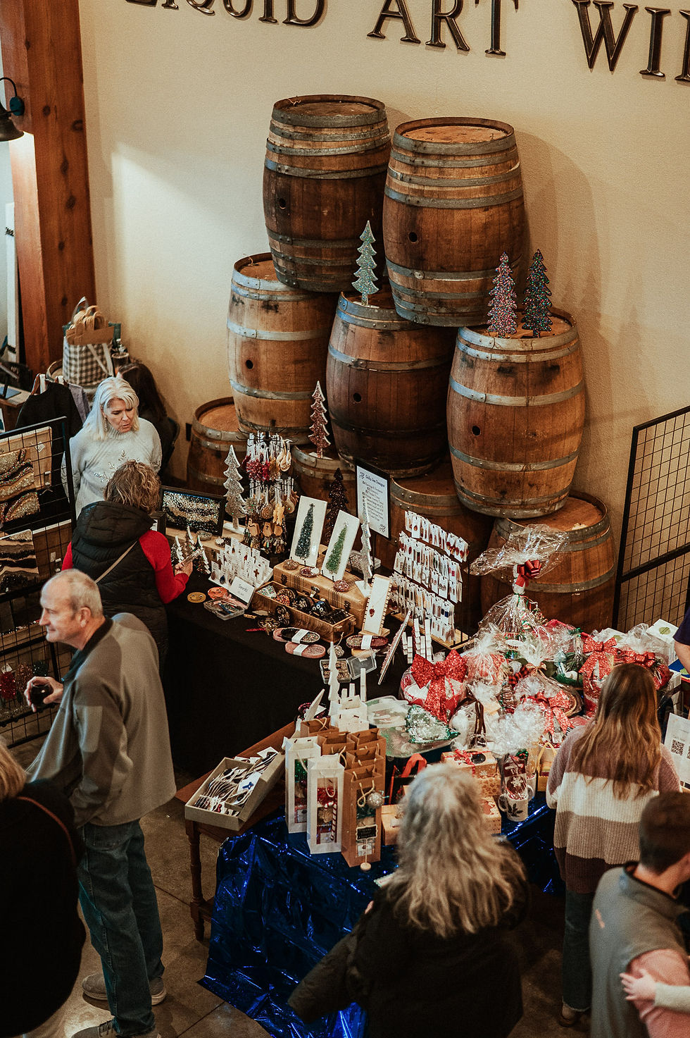 A picture from the Sip & Shop event, with vendor stalls in the Event Center.